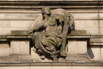 Detail of carved figure, repressenting 'Achievement',  on Grindlay Street facade