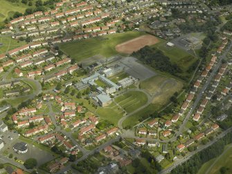 Oblique aerial view centred on the academy, taken from the SSW.