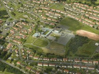Oblique aerial view centred on the academy, taken from the SE.