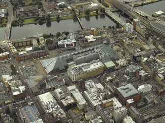 Oblique aerial view centred on the shopping centre, taken from the NE.