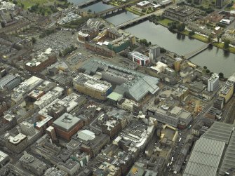 Oblique aerial view centred on the shopping centre, taken from the S.