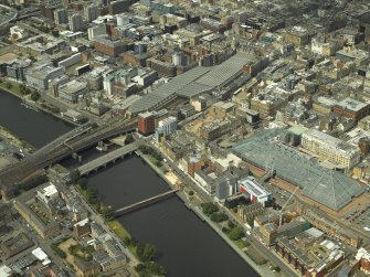 Oblique aerial view of the shopping centre and the station, taken from the SSE.