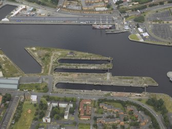 Oblique aerial view of the docks with the tall ship adjacent, taken from the SSW.