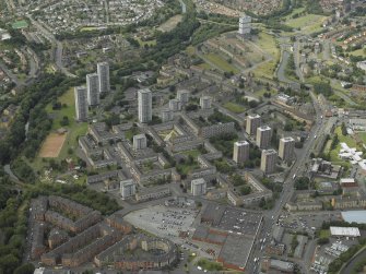 General oblique aerial view of the flats, housing and school, taken from the SE.