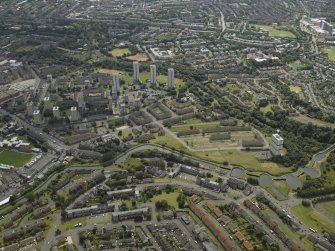 General oblique aerial view of the canal, flats and housing, taken from the NNE.