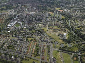 General oblique aerial view of the canal, flats and housing, taken from the NNW.