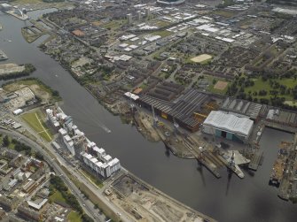 Oblique aerial view of the docks and ship yard, taken from the NNW.