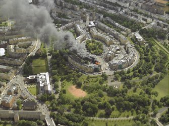 General oblique aerial view of Park Circus and the housing during the fire in Park Gate, taken from the NW.