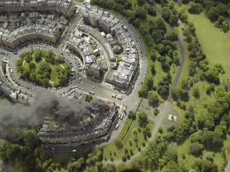 Oblique aerial view of Park Circus and the housing during the fire in Park Gate, taken from the N.