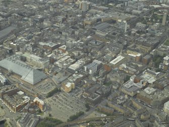 General oblique aerial view of the city centre with the shopping centre in the foreground, taken from the SE.