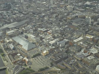 General oblique aerial view of the city centre with the shopping centre in the foreground, taken from the SE.