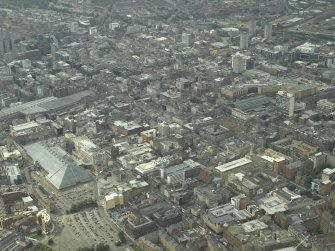 General oblique aerial view of the city centre with the shopping centre in the foreground, taken from the ESE.