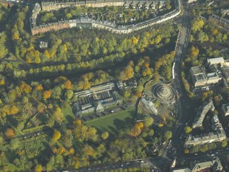 Oblique aerial view of the botanic gardens and glasshouses with the conservatory under renovation, taken from the SSW.