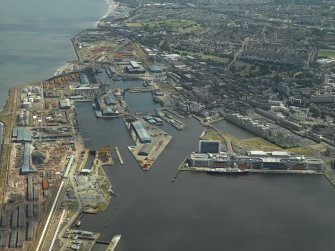 General oblique aerial view of the docks, taken from the NW.