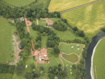 Oblique aerial view centred on the house, taken from the SW.