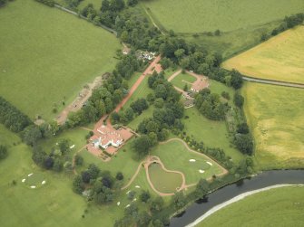 Oblique aerial view centred on the house, taken from the SSW.