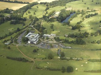General oblique aerial view of the country house hotel, farmsteading, stables and golf course, taken from the SW.