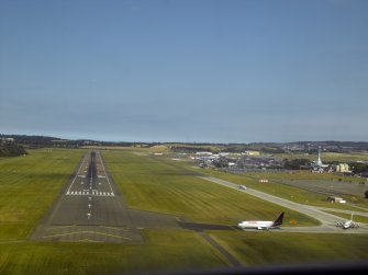 Oblique aerial view of the runway at the airport while coming in to land, taken from the SW.