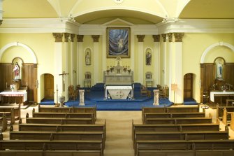 Interior.Axial view from gallery looking west to chancel