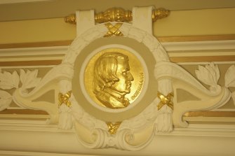 Interior. 1st floor, corridor, detail of roundel (Schumann)