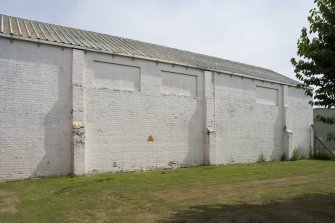 View.  Former Triple Turret Trainer, type A, now lubricant store showing rear from NW.