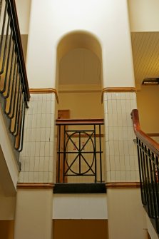 Interior. 1st floor, backstage, stairwell, view showing balustrade and arch on landing