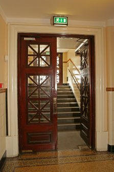 Interior. Ground floor, backstage, view of double door and stair leading to exit