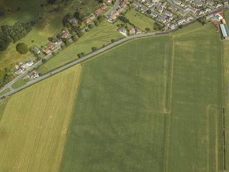 Oblique aerial view centred on the parchmarks of the cursus, taken from the SSW.