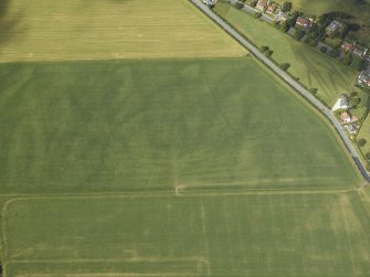 Oblique aerial view centred on the parchmarks of the cursus, taken from the ESE.