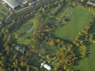 Oblique aerial view of the gardens, museum and conservatory, taken from the NE.