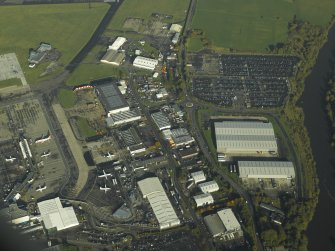 Oblique aerial view of the airport buildings, taken from the S.