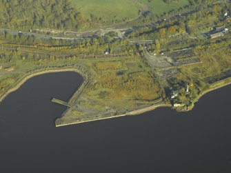 Oblique aerial view centred on the water front to the W of Bowling and the castle, taken from the SW.