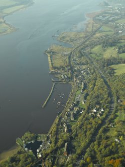 General oblique aerial view of the barbour, shipyard and castle, taken from the E.
