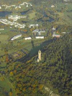 General oblique aerial view centred on the Wallace Monument with the university adjacent, taken from the SSW.
