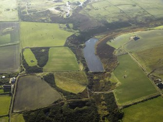 Oblique aerial view centred on the reservoir and the remains of the flint mines, taken from the NNE.
