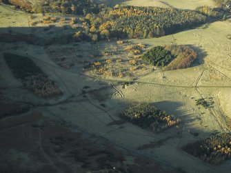 Oblique aerial view centred on the remains of the practice trenches, taken from the E.