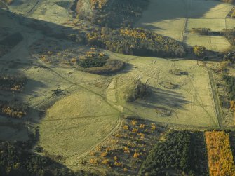 Oblique aerial view centred on the remains of the practice trenches, taken from the ENE.