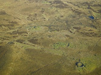 Oblique aerial view centred on the sheepfold and the remains of the sheepfolds, field-system and rig, taken from the WNW.