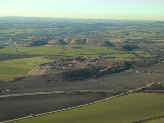 General oblique aerial view centred on the shale-oil bing, taken from the NE.
