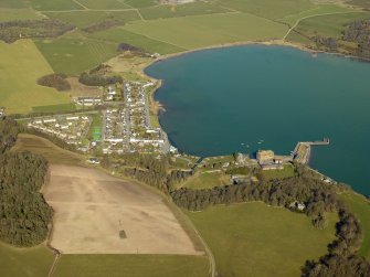 General oblique aerial view centred on the village with the harbour and mill adjacent, taken from the SE.