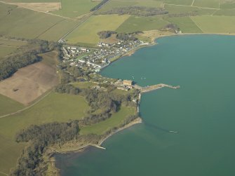 General oblique aerial view centred on the village with the harbour and mill adjacent, taken from the SE.