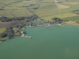 General oblique aerial view centred on the village with the harbour and mill adjacent, taken from the E.