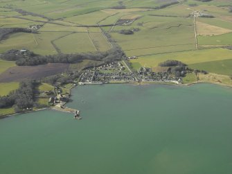 General oblique aerial view centred on the village with the harbour and mill adjacent, taken from the ENE.