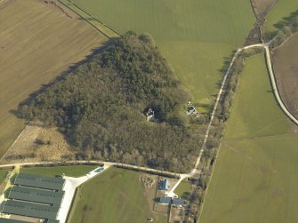 Oblique aerial view centred on the remains of the tower-house, taken from the SW.