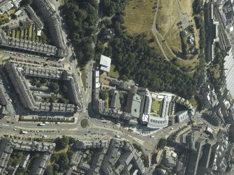 Oblique aerial view centred on the hotel, cinemas and theatre with the observatories adjacent, taken from the NE.