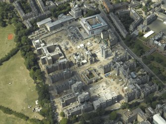 Oblique aerial view centred on the redevelopment of the hospital for housing, taken from the ESE.