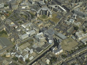 General oblique aerial view centred on the cinema, canal basin and offices, taken from the S.