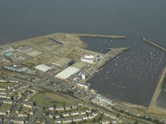 General oblique aerial view centred on the harbour, taken from the SSE.