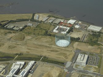 Oblique aerial view centred on the gasholder, taken from the SE.