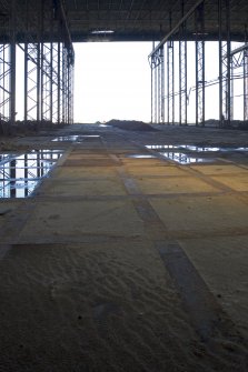 Interior.  View from SW along central bay, looking towards open side of Deck Assembly building.